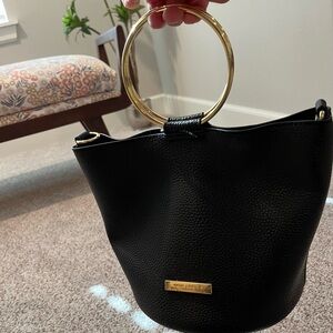 Black faux leather metal ring handle purse, Katie Loxton of London ￼